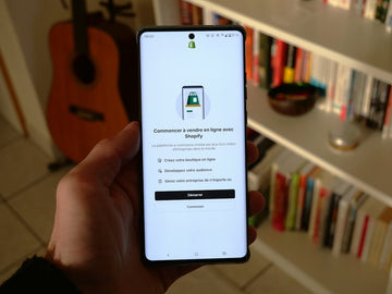 A phone shows a shopify app setup screen